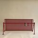 Vintage perforated red metal shelf