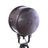 Old industrial spot on wooden tripod