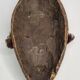 Tribal Dan mask in wood and cowrie shells, West Africa, 27 cm