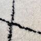 White Berber rug with black diamonds
