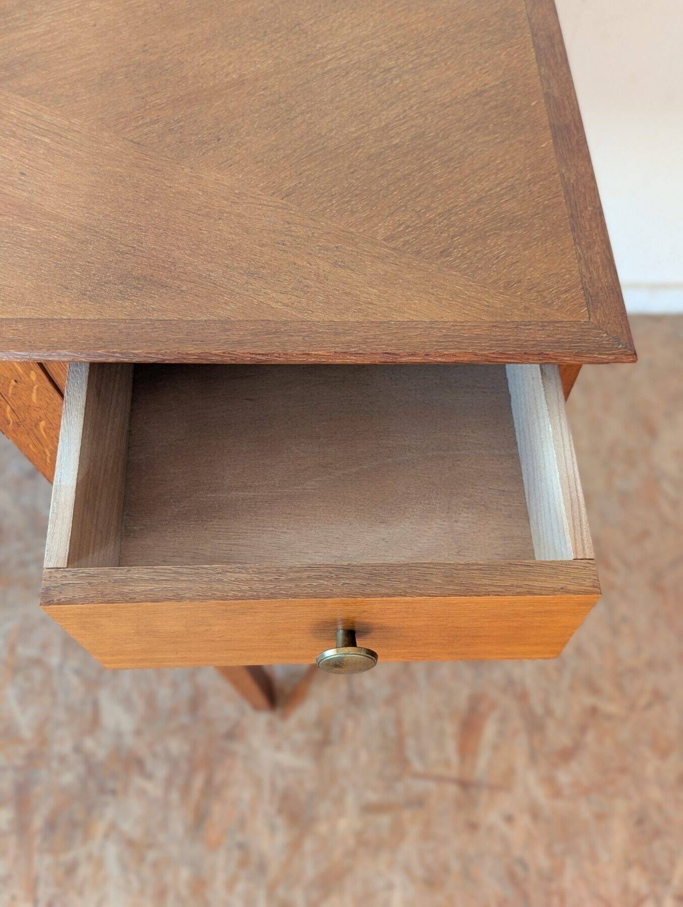1950s oak double-sided desk with compass legs.