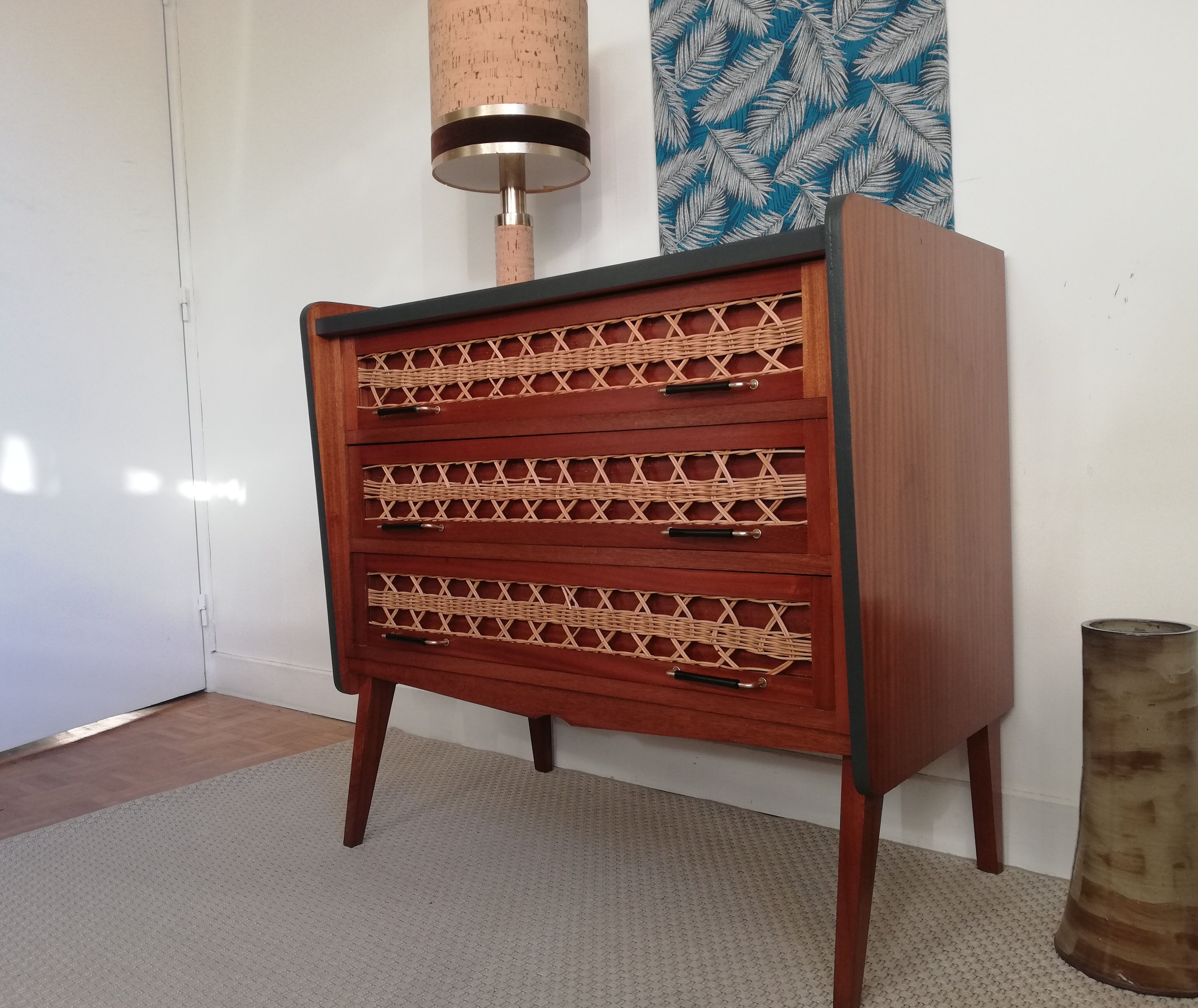 Teak and rattan chest of drawers feet compass