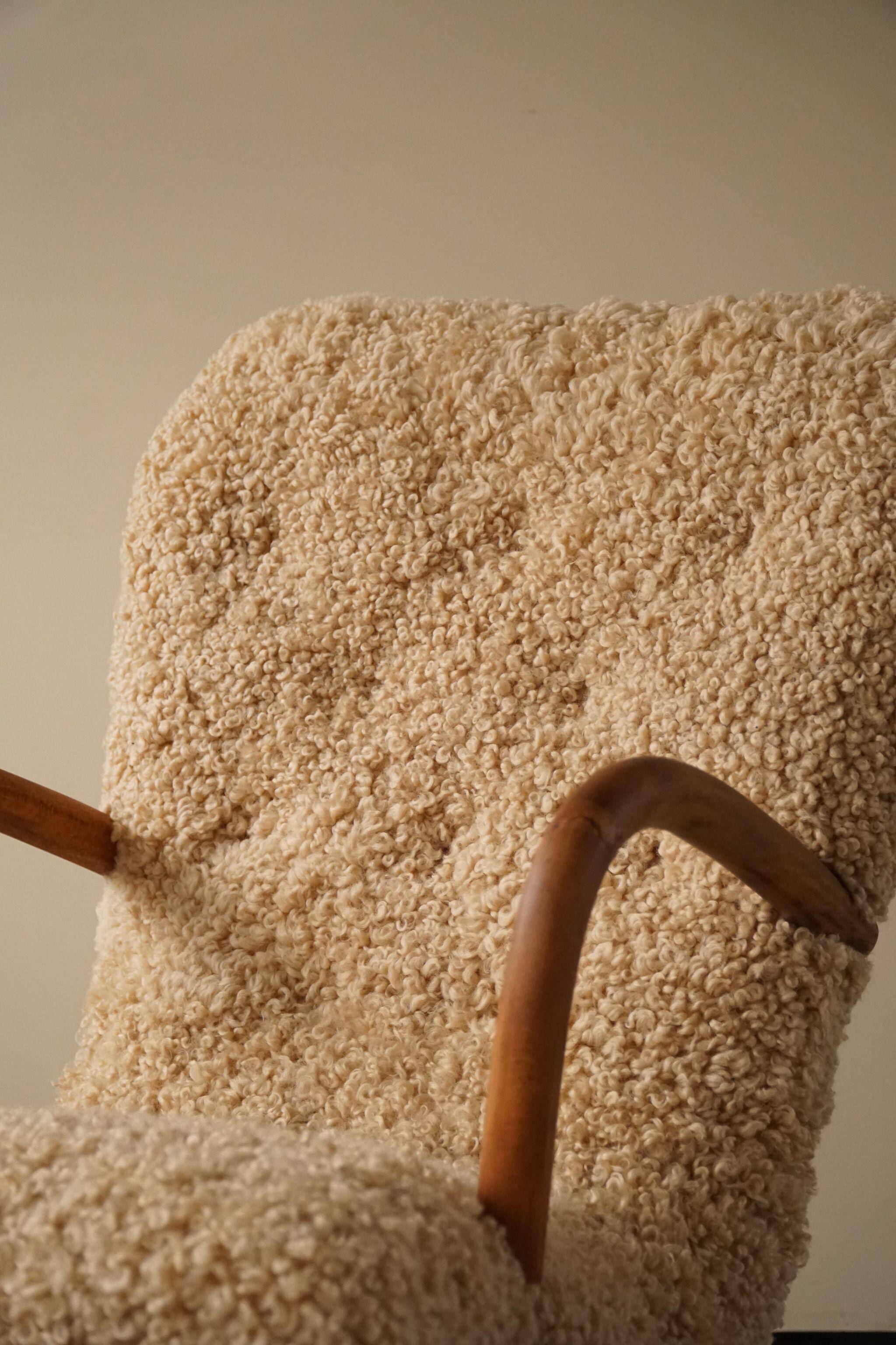 Pair of clam chairs in lambswool, Skive Møbelfabrik, Denmark, 1950s