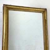 19th century mercury mirror with wooden frame and gilded stucco