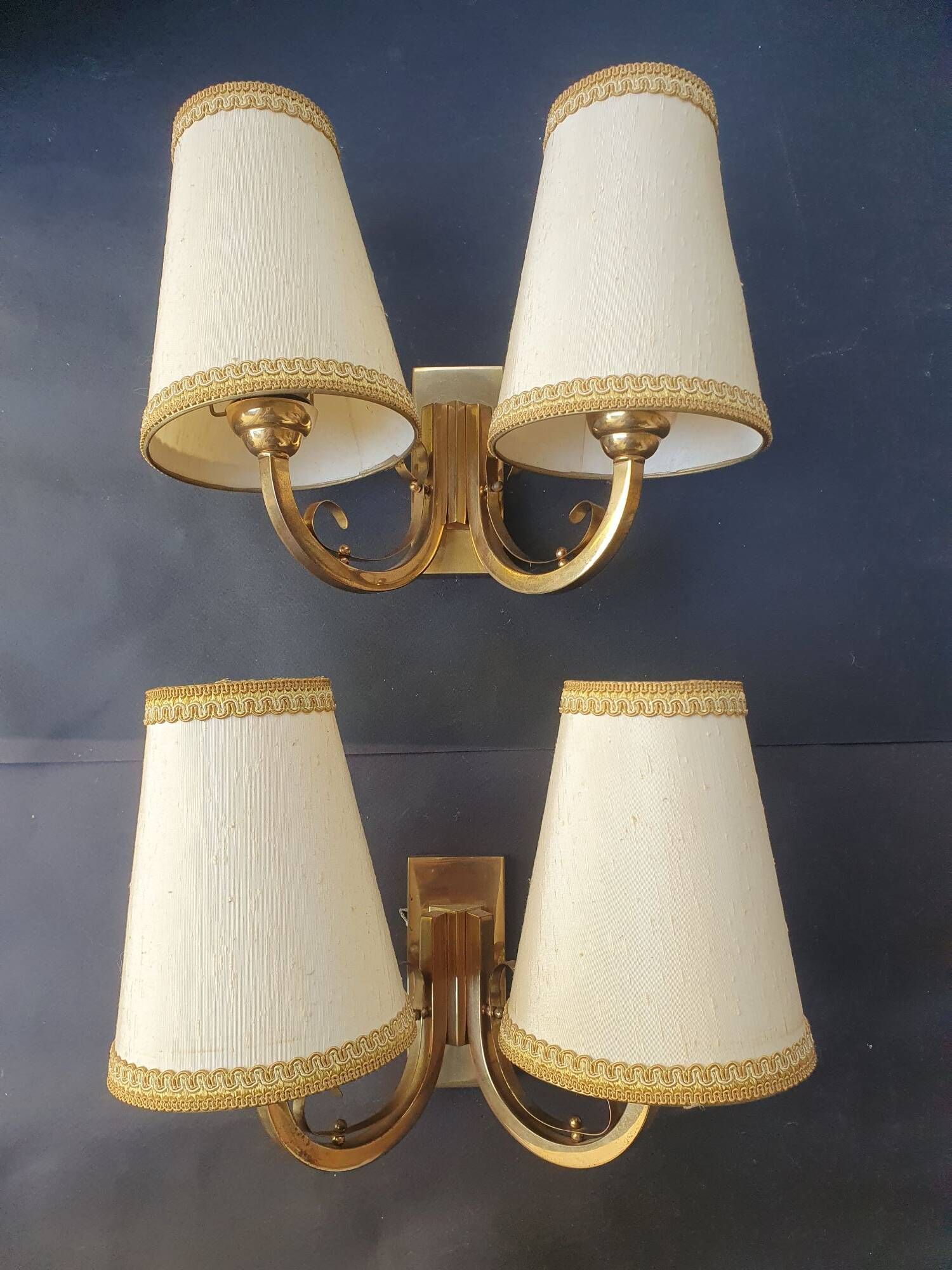 Pair of bronze wall sconces with 1940s Art Deco lampshades.
