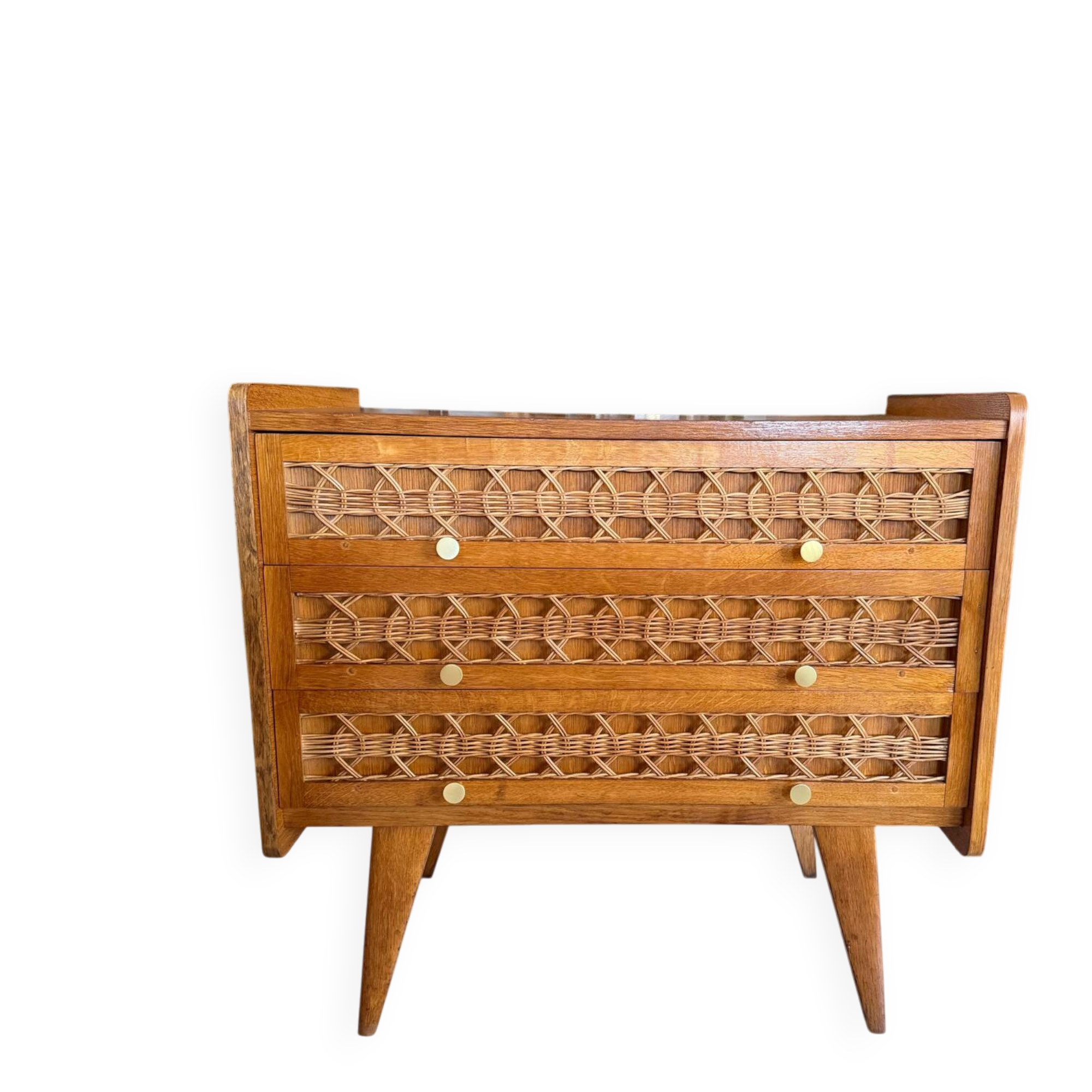 Vintage wooden and rattan chest of drawers with tapered legs.