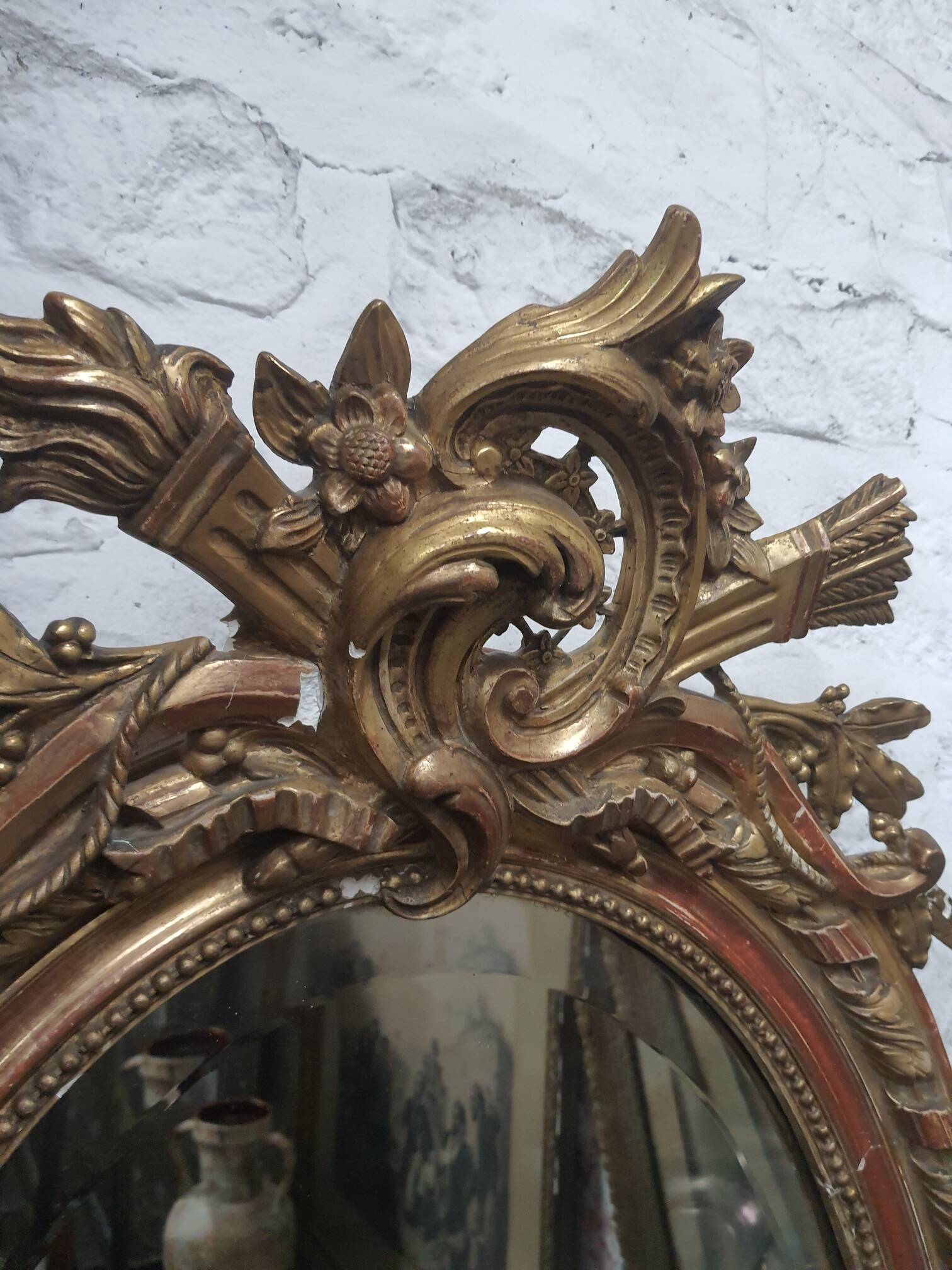 Golden oval mirror