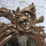 Golden oval mirror