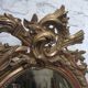 Golden oval mirror