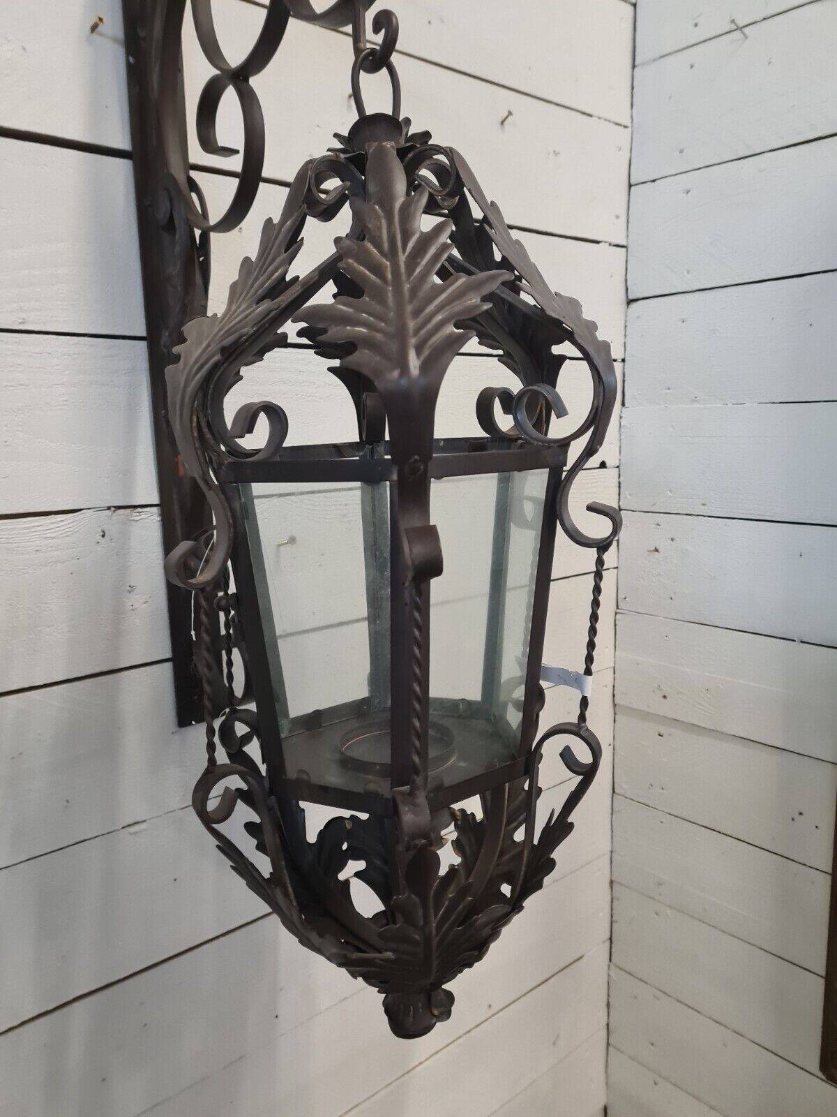 Patinated iron wall lantern