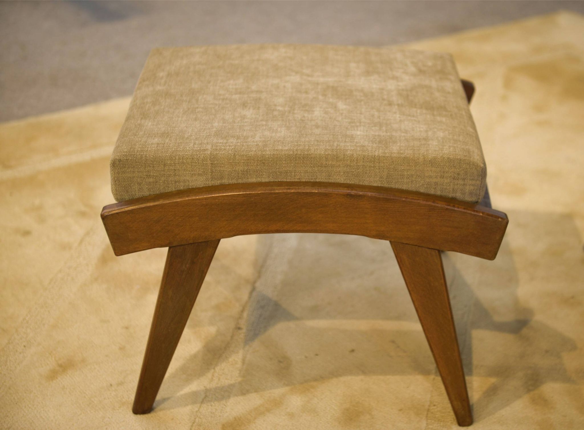 Scandinavian armchair and two 1960s ottomans.
