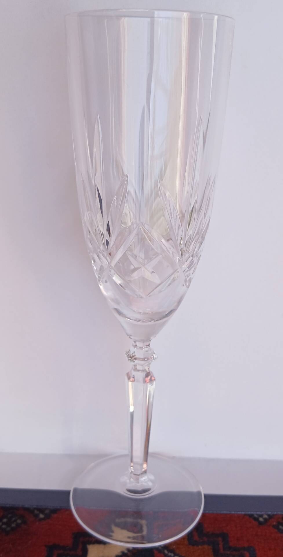 6 crystal champagne flutes from Lorraine Walsheid in their case.