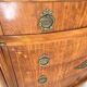 The demi-lune commode/ chest of drawers