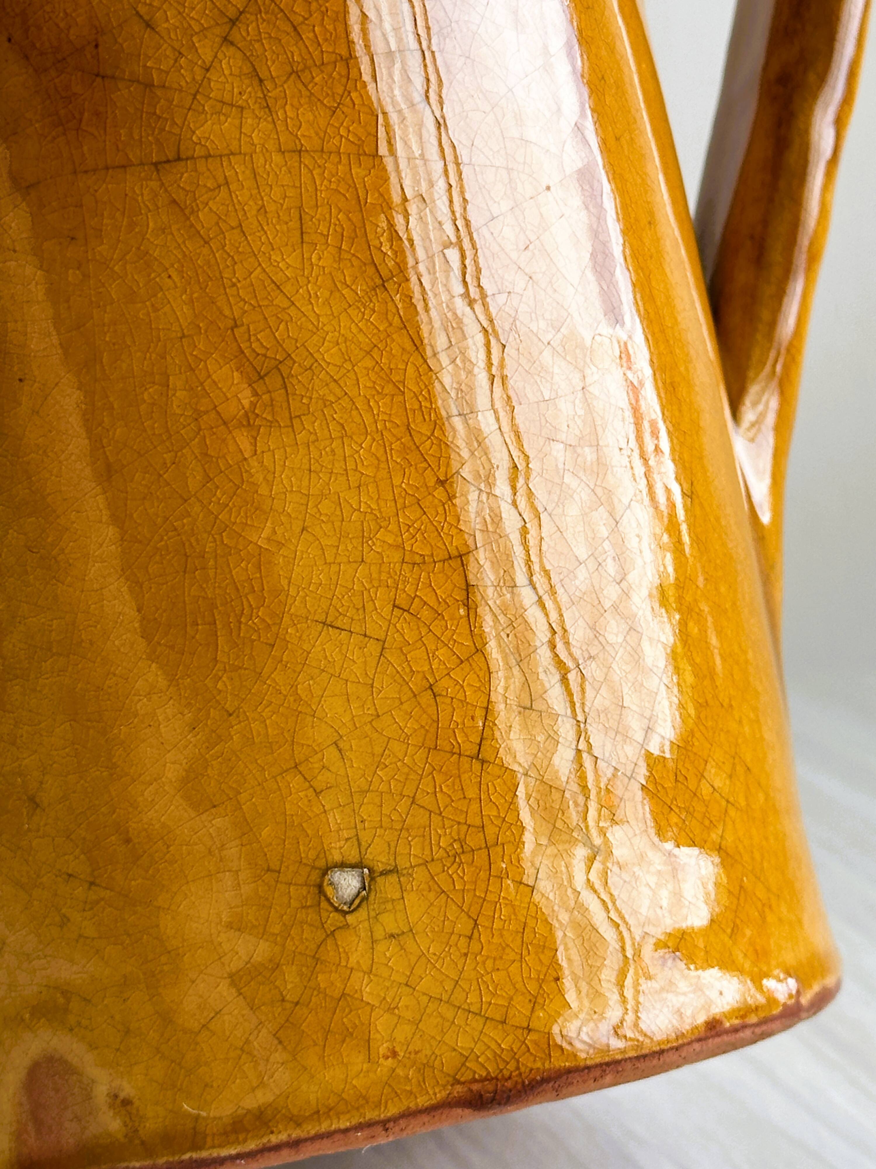 Vintage enameled ceramic watering can vase - retro mustard yellow pot.