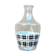 Vintage decanter with black and white tiles