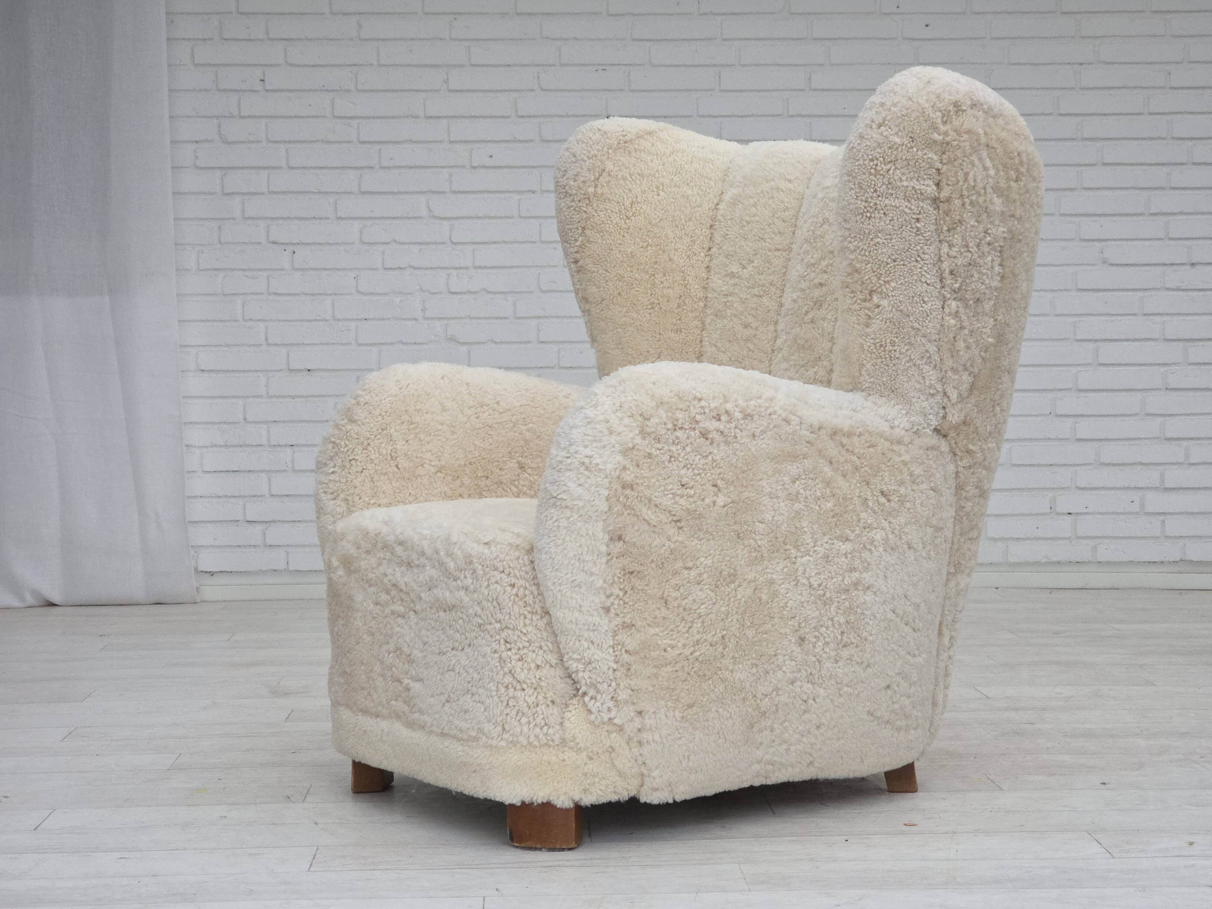 1960s, Danish design, reupholstered highback armchair, genuine sheepskin.