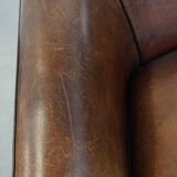 Sheep leather club chair finished with black piping