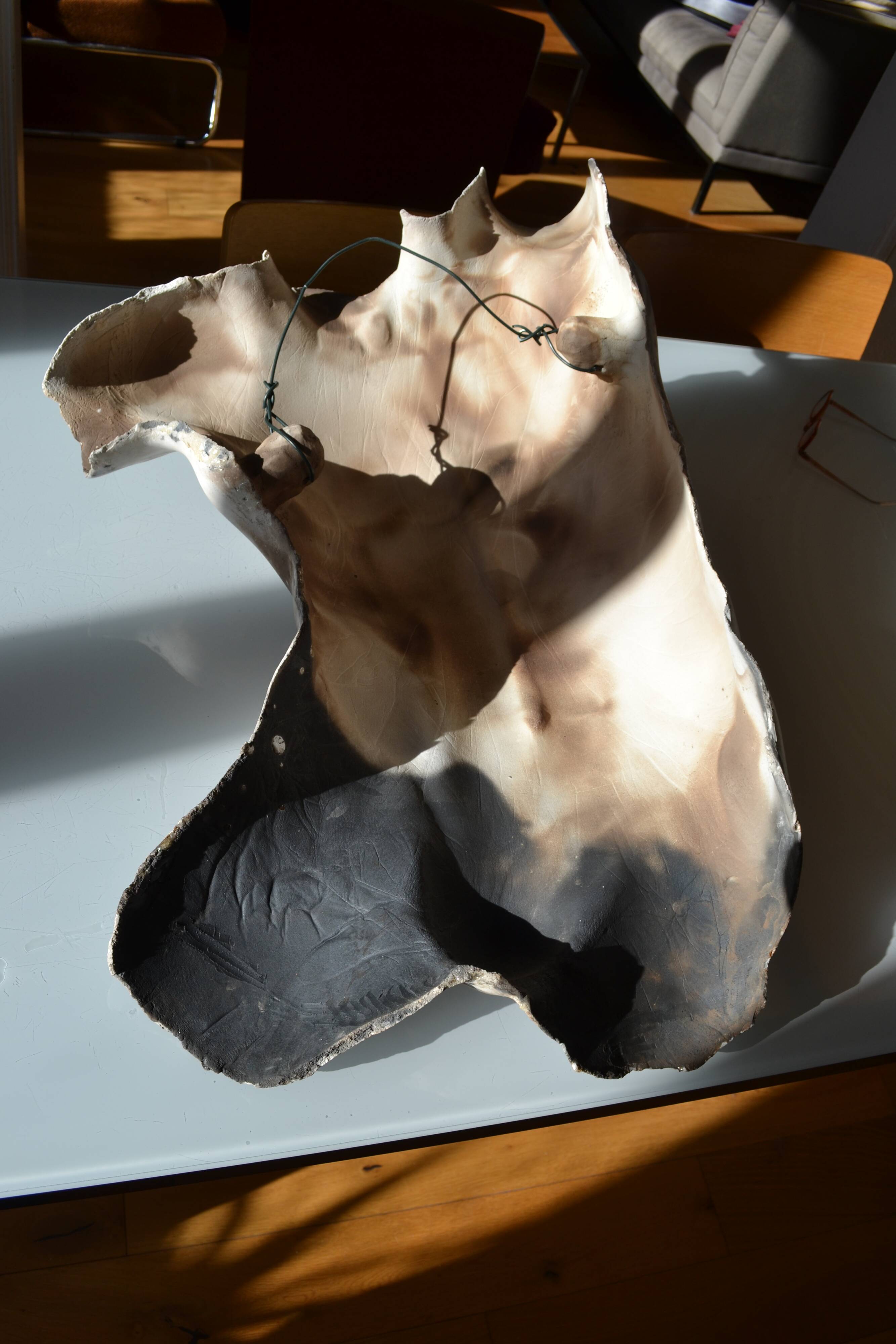 Male torso sculpture by patinated casting, signed to be identified.