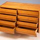 Vintage Czech chest of drawers U-453 by Jiří Jiroutek, 1960s, oak veneer, 110 × 45 × 77 cm