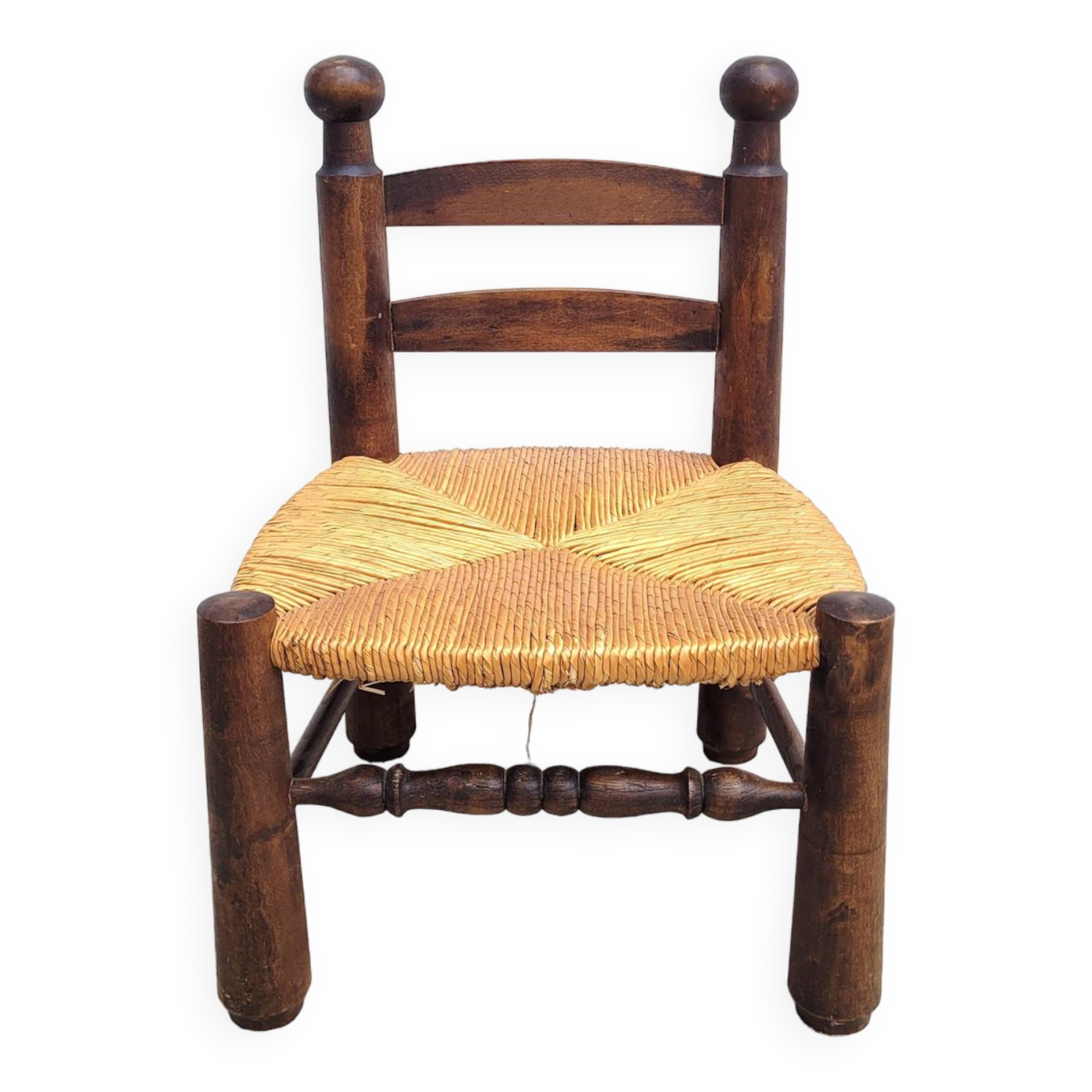 Low chair in turned wood and straw