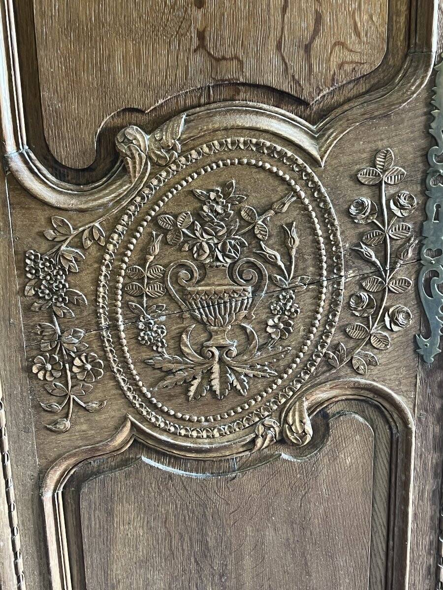 19th-century Norman wedding armoire, with bouquets of flowers and doves.