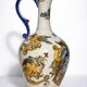 Gien earthenware jug, Renaissance decoration, putto with dolphin.