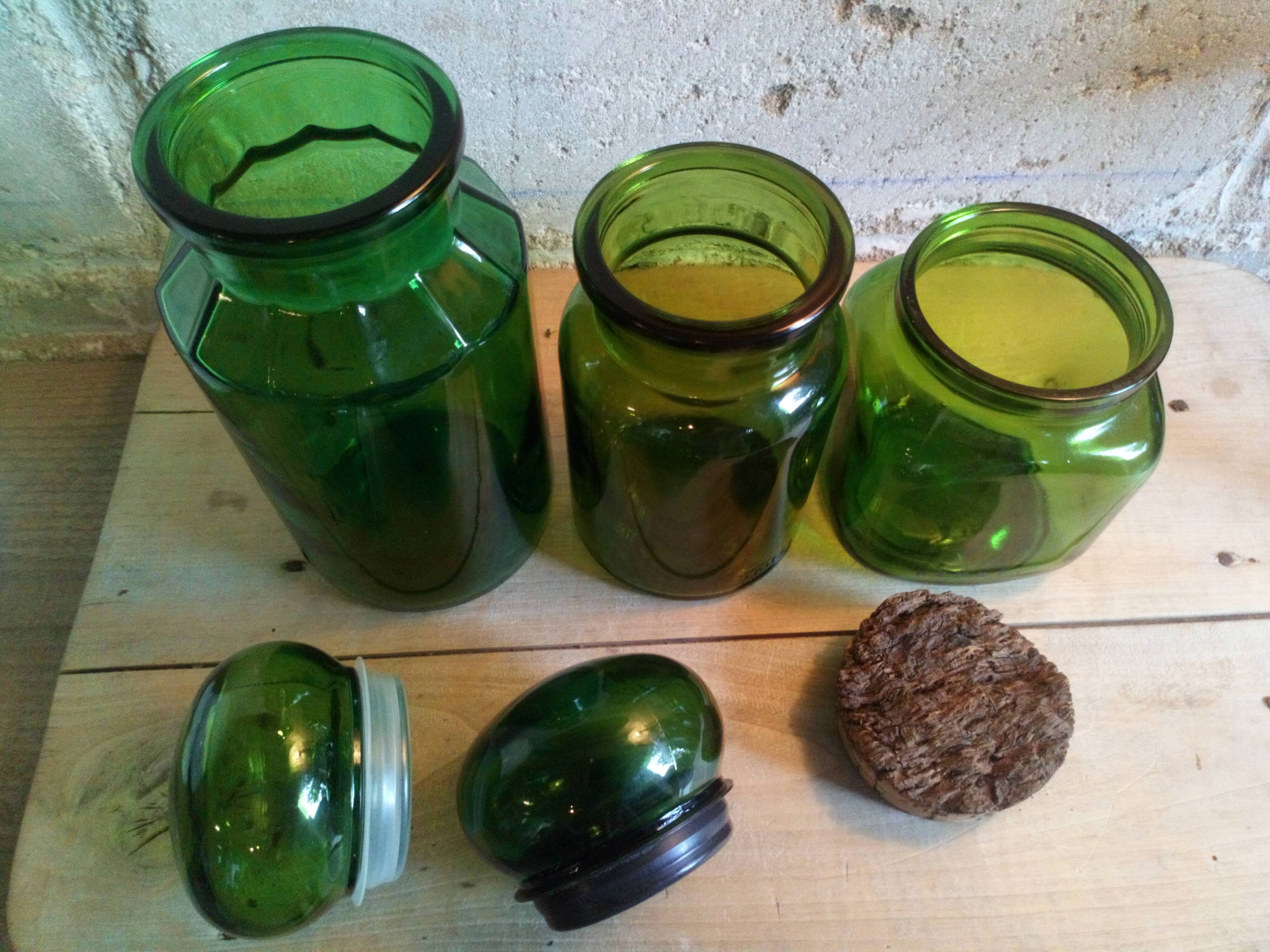 Trio of green glass apothecary bottles