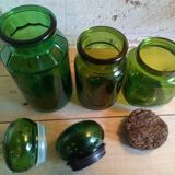 Trio of green glass apothecary bottles
