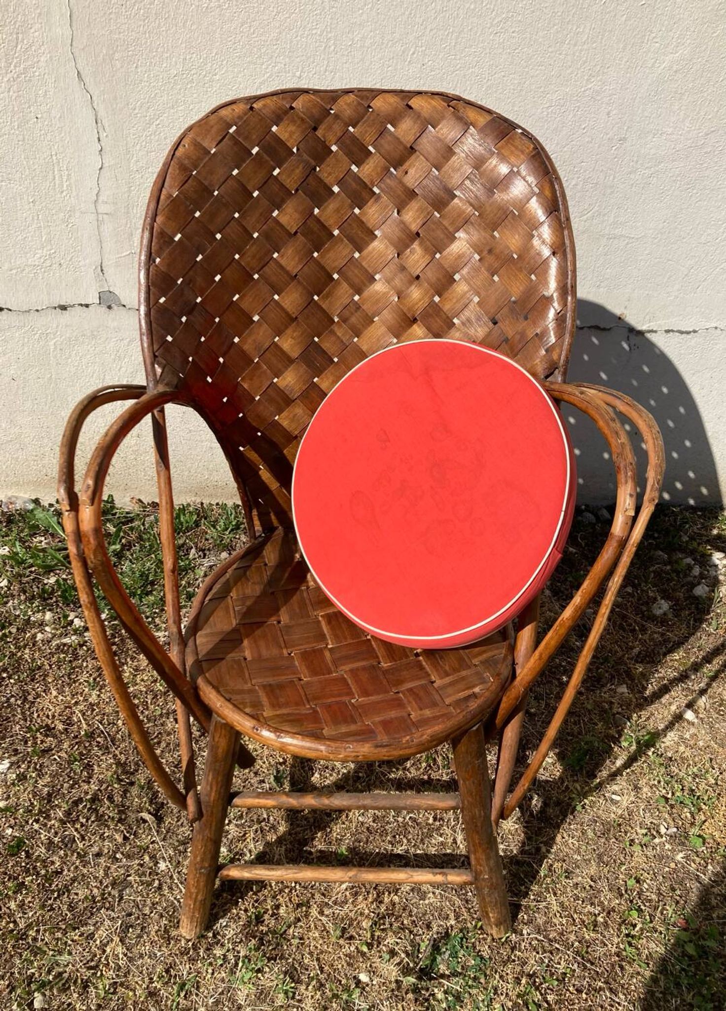 Vintage 1970s armchair in curved woven chestnut + seat cushion