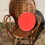 Vintage 1970s armchair in curved woven chestnut + seat cushion