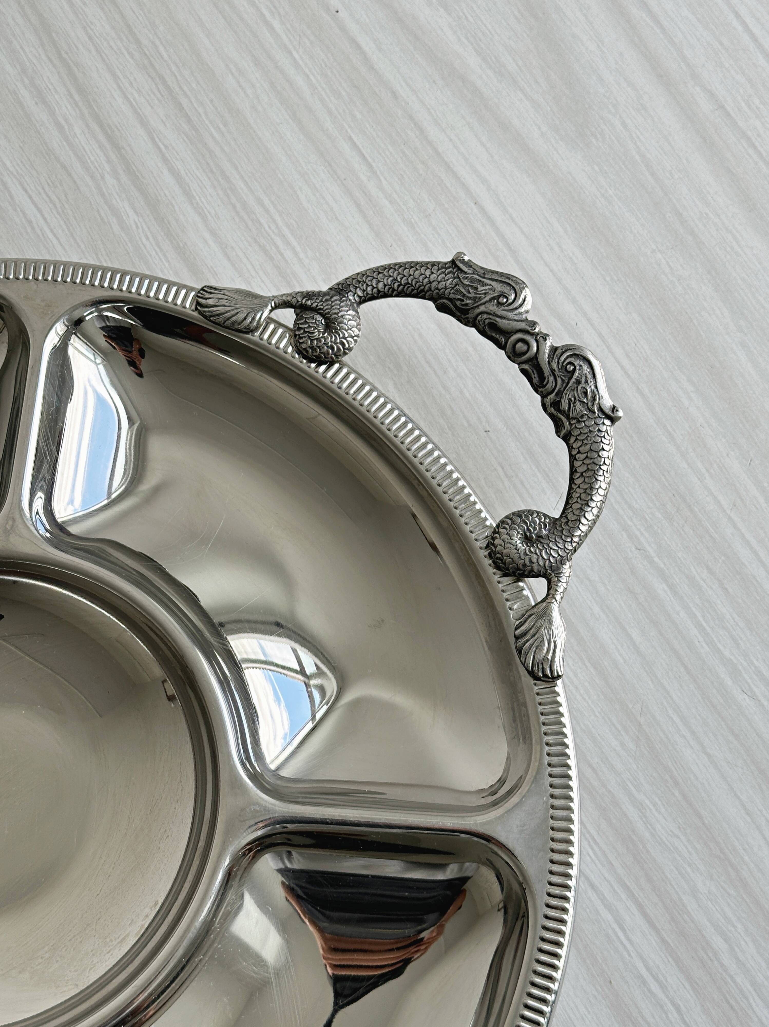 Vintage silver-plated metal serving tray with compartments.