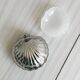 Antique shell butter dish in white glass and metal