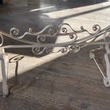 Old wrought iron cradle painted