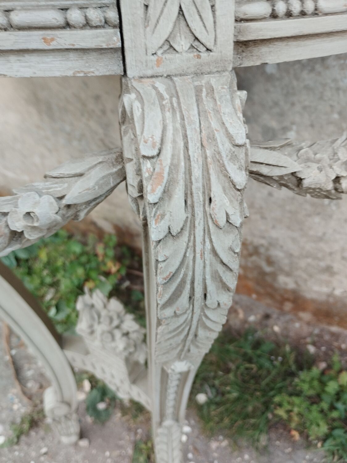 Beautiful antique wooden console with a marble top in Louis XVI style.