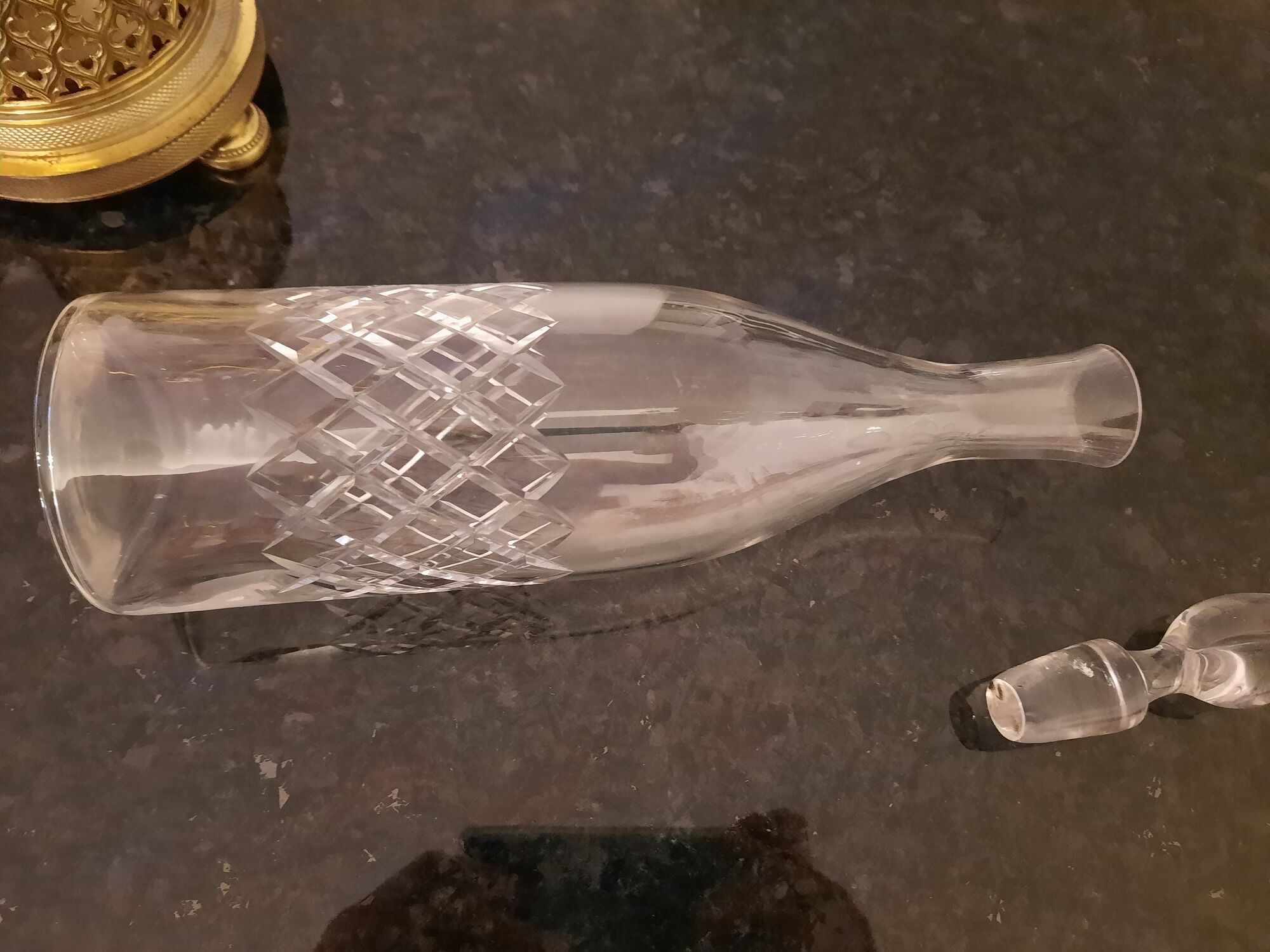 3 crystal decanters diamond cut set of 3 crystal decanters in a gold gold support,