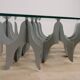 Minimalist sculptural coffee table in metal and glass
