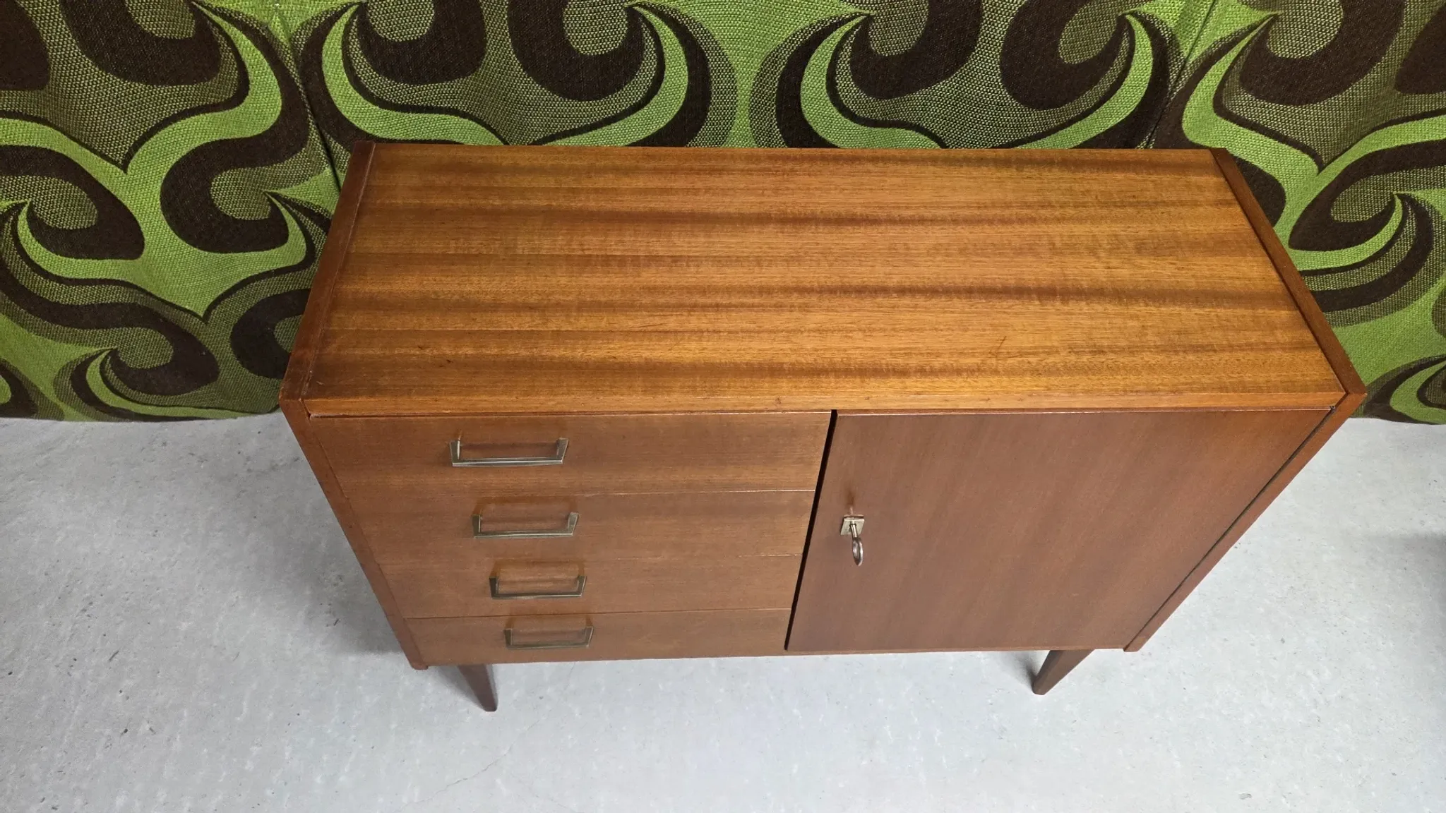 Small vintage sideboard from the 1960s with 4 drawers and a door.