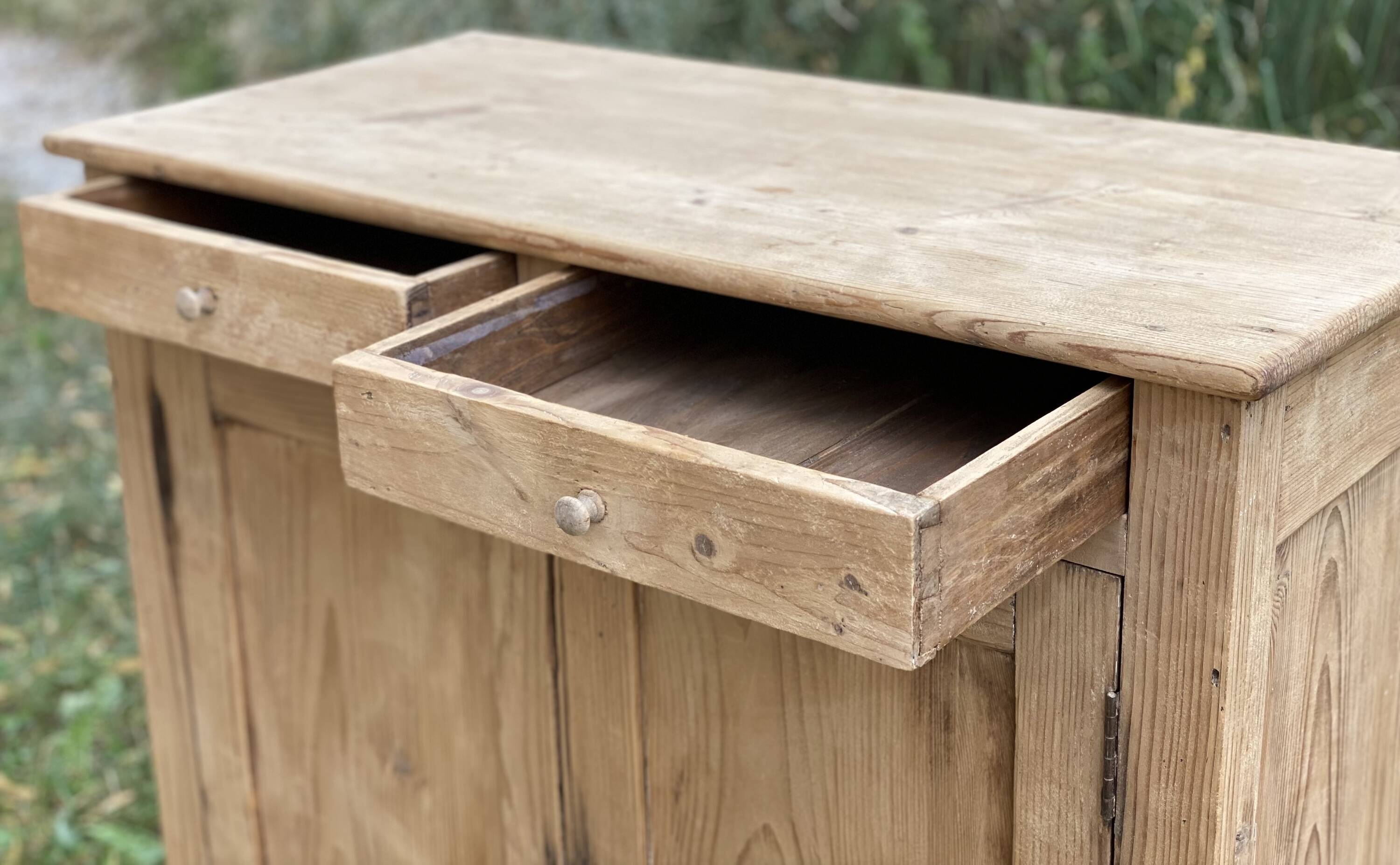 Small Parisian buffet with 2 doors and 2 drawers in light wood.