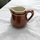 Brown ceramic teapot and milk jugs