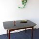 Folding table with black and gold painted glass, 1950