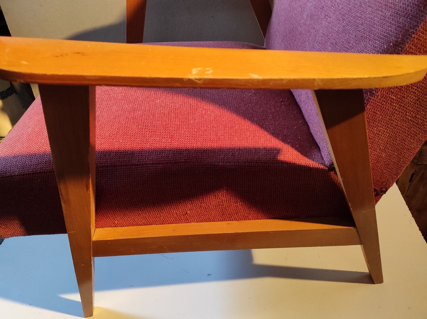 Vintage red armchair with compass feet in Scandinavian design