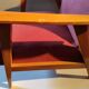 Vintage red armchair with compass feet in Scandinavian design