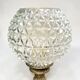 Antique brass foot lamp with glass globe and diamond point.