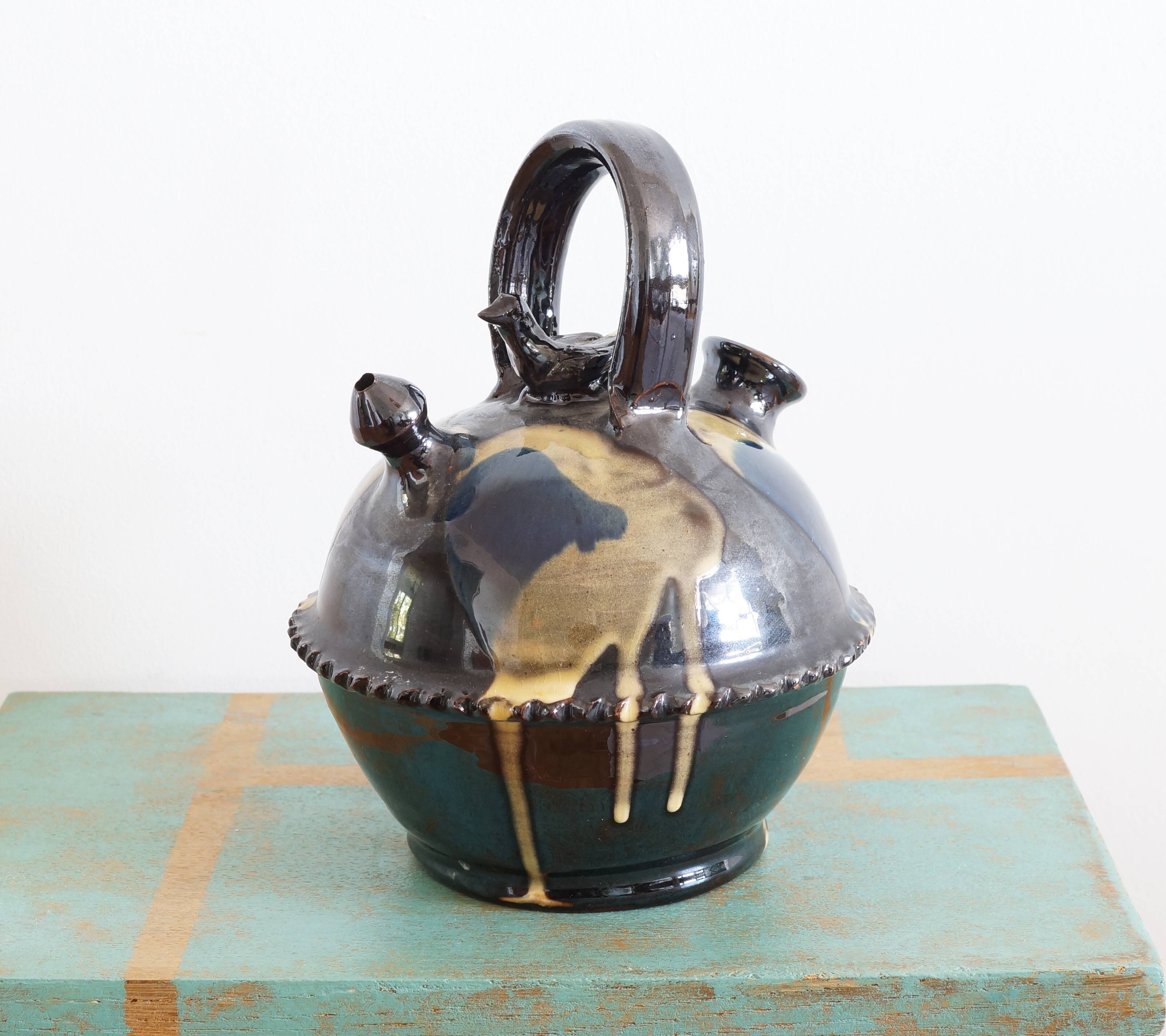 Glazed terracotta gargoulette with bird decoration