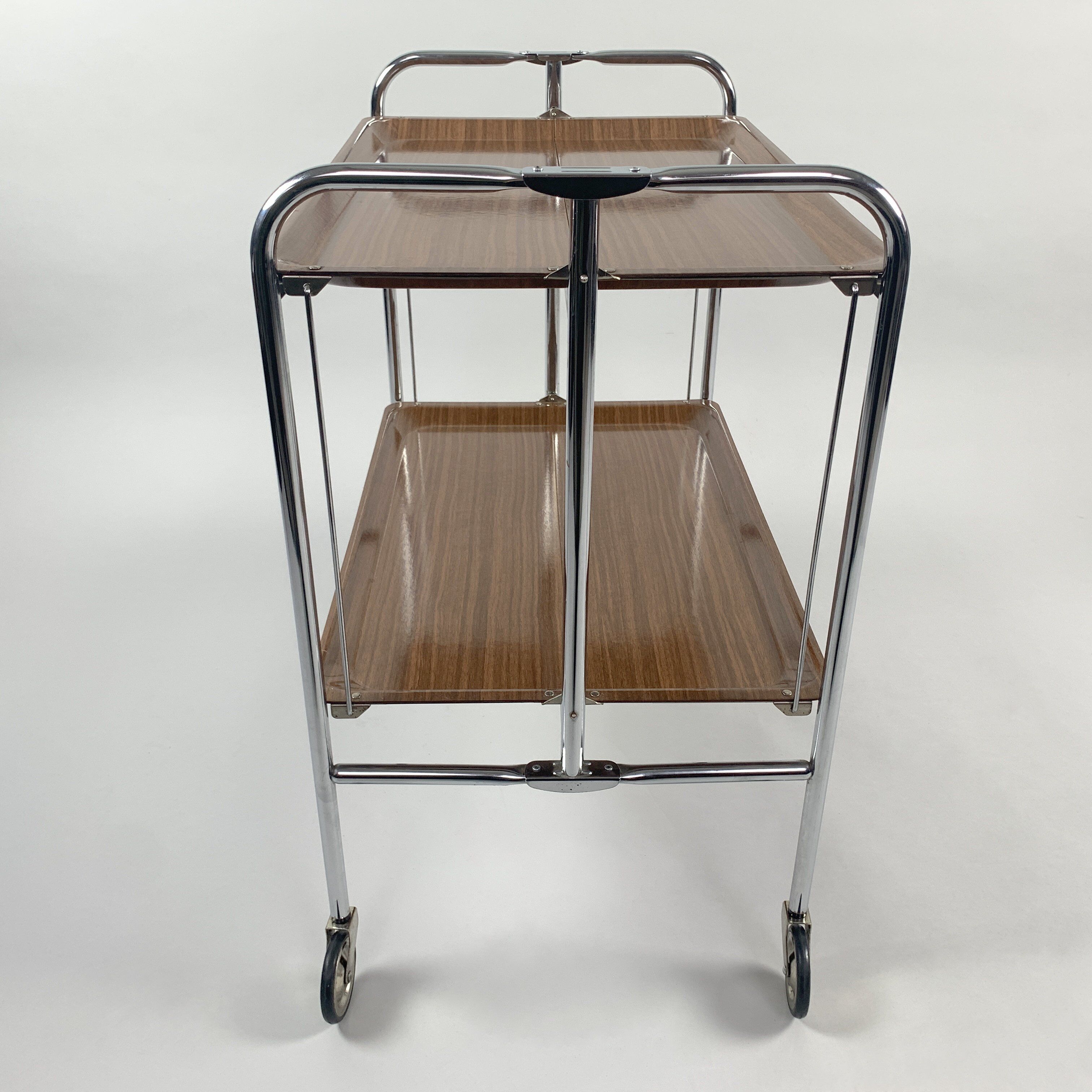 Chrome and laminated wood folding serving trolley, 1950