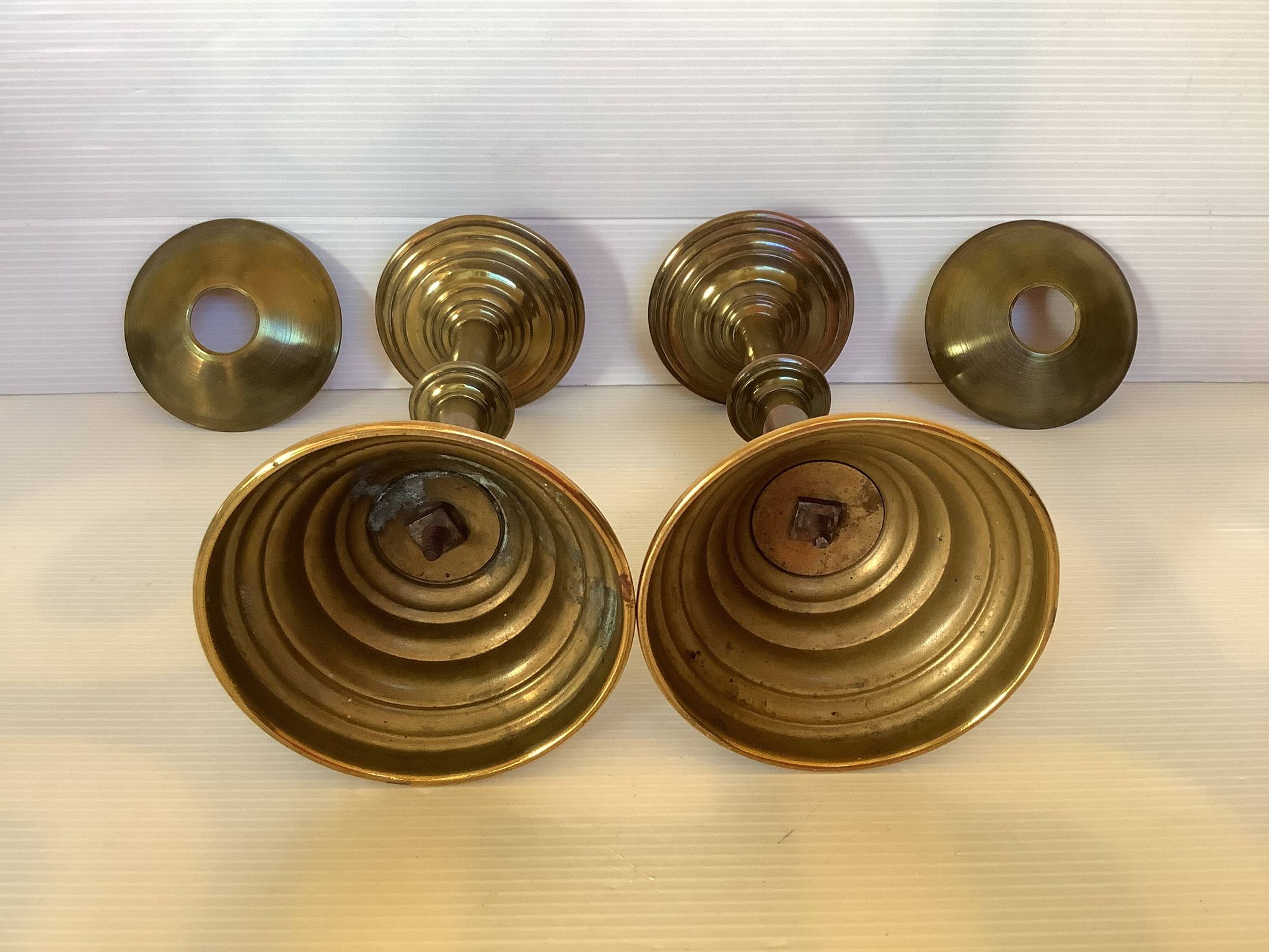 Pair of tulip foot candlesticks in brass