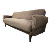 Vintage armchair/sofa/lounge in taupe colour with a stain.