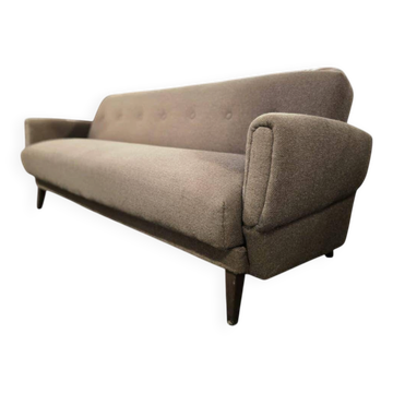 Vintage armchair/sofa/lounge in taupe colour with a stain.