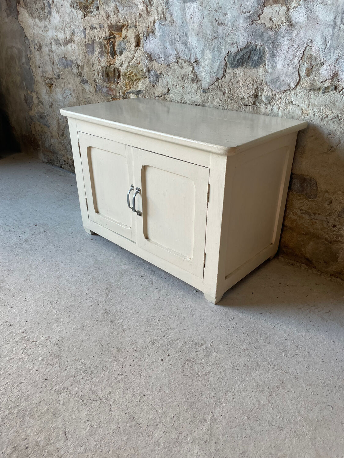 Antique white patinated low cabinet