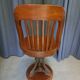 Swivel American chair in walnut and cast iron